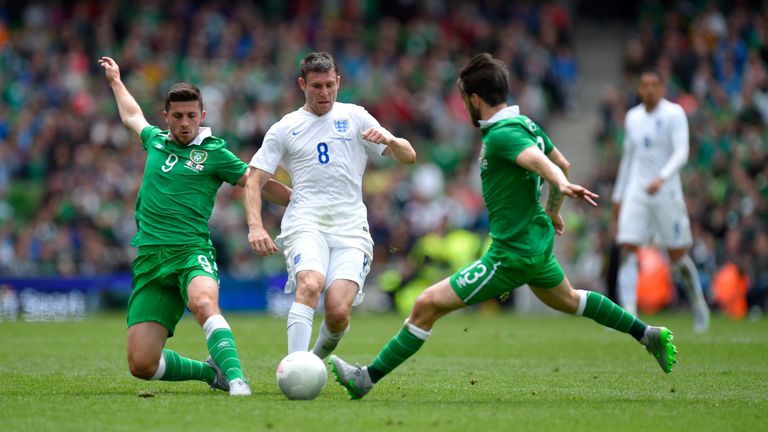 England player James Milner is challenged by Shane Long and Harry Arter during the International friendly at Aviva Stadium on June 7, 2015 in Dublin.