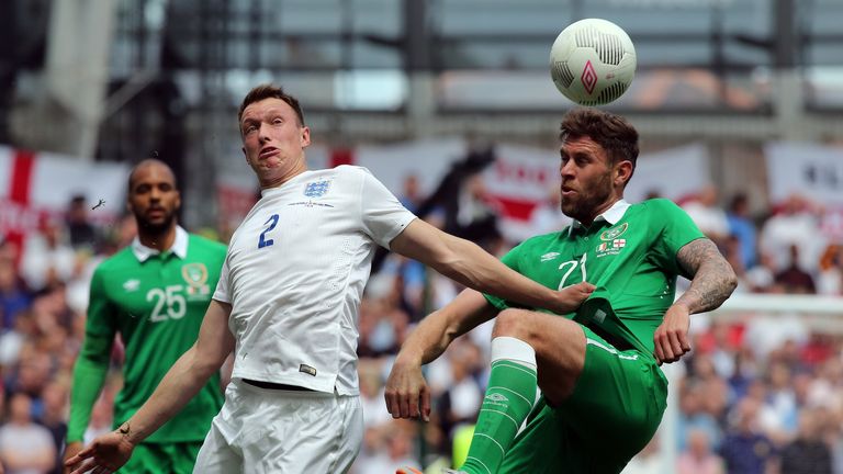 England defender Phil Jones vies with Republic of Ireland striker Daryl Murphy during the international friendly at Aviva Stadium in Dublin on June 7, 2015