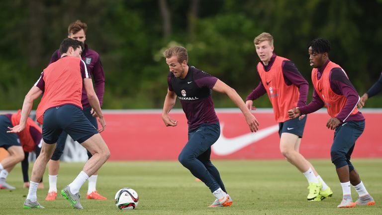 Michael Keane tackles Harry Kane during an England U21 Training Session