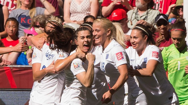 Claire Rafferty #3 of England celebrates team mate Lucy Bronze's #12 (not pictured) goal against Canada walks during the FIFA Women's World Cup