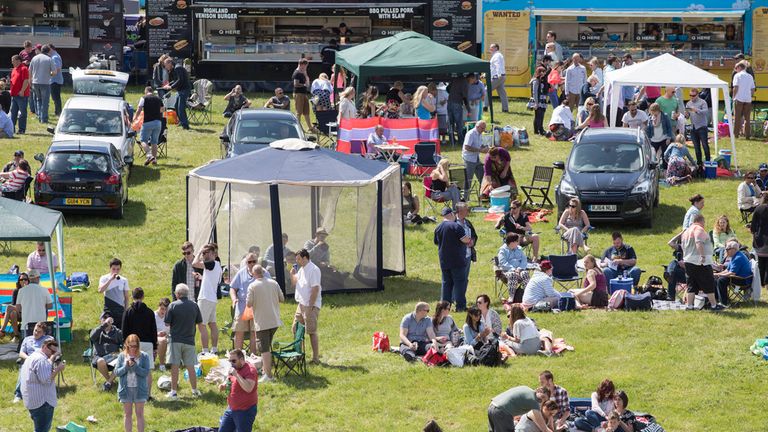 Racegoers set up on the hill on Derby Day at Epsom