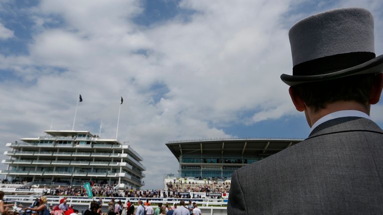 A gentleman wears a morning suit at Epsom