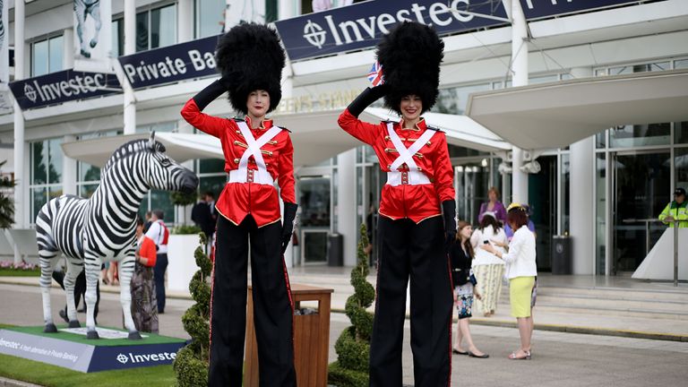 Stilt walkers dressed as Queen's Guards