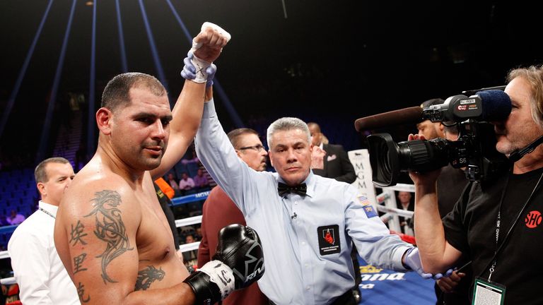 LAS VEGAS, NV - JANUARY 17:  Eric Molina has his arm raised by referee Russell Mora after beating Raphael Zumbano in a heavyweight fight at the MGM Grand G