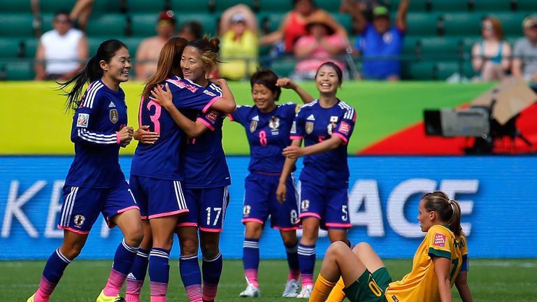 EDMONTON, AB - JUNE 27:  Homare Sawa #10, Rumi Utsugi #13 and Yuki Ogimi #17 of Japan celebrate their 1-0 win over Australia in the FIFA Women's World Cup 