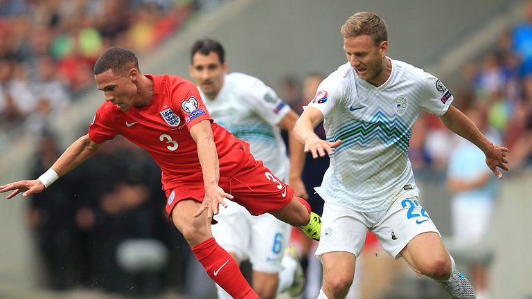 England's Kieran Gibbs (left) and Slovenia's Ales Mertelj battle for the ball during the UEFA European Championship Qualifying match at the Stozice Stadium