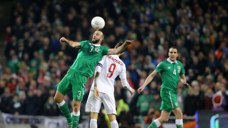 Republic of Ireland's Marc Wilson and Poland's Robert Lewandowski battle for the ball