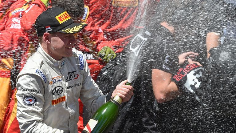 Stoffel Vandoorne sprays champagne as he celebrates his victory in Monaco 