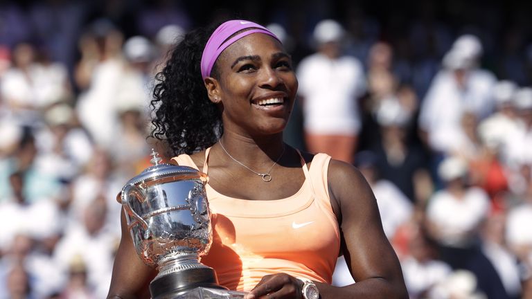 Serena Williams celebrates with the trophy after winning the French Open