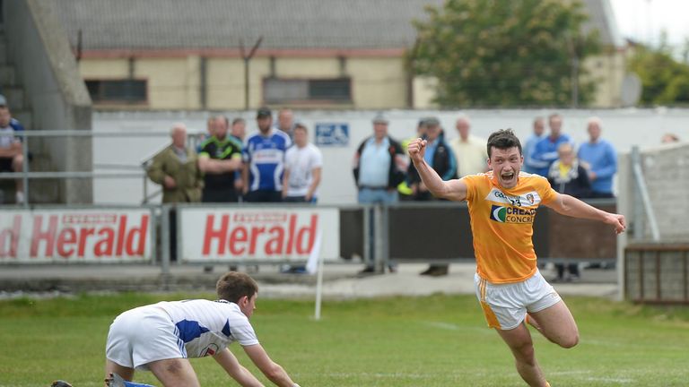 Dermot McAleese celebrates after scoring Antrim's second goal
