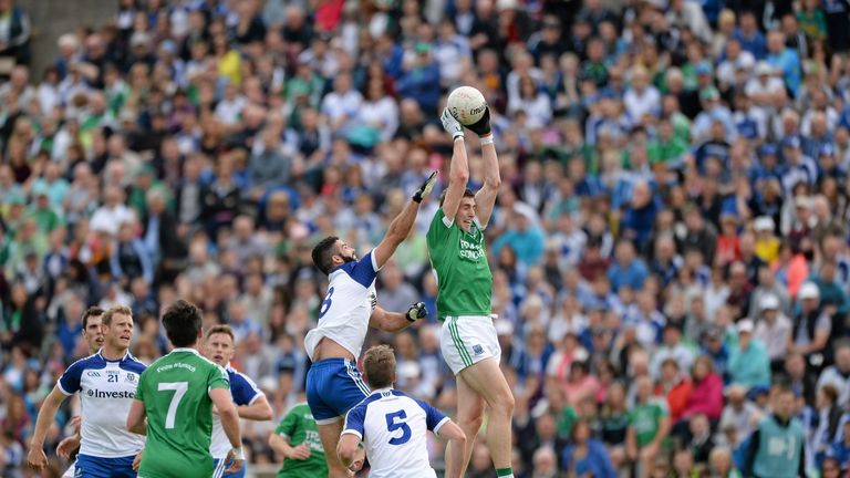 Fermanagh's Eoin Donnelly cathches a kickout above Neil McAdam of Monaghan. 