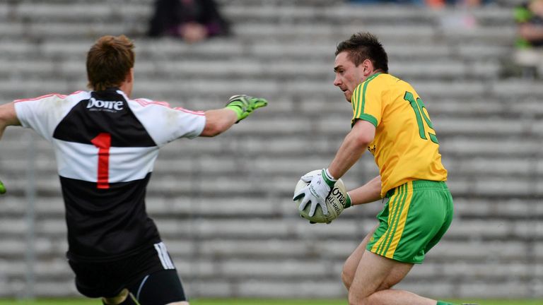 Martin O'Reilly rounds Thomas Mallon to score Donegal's goal against Derry