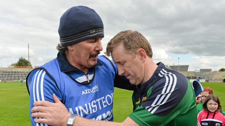 Laois manager Seamus Plunkett is congratulated by Offaly counterpart Brian Whelahan after the final whistle