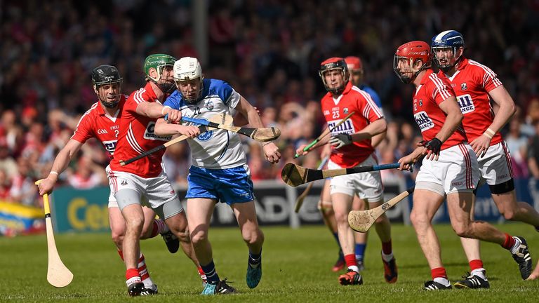 Shane Bennett, Waterford, in action against Shane O'Neill, 2, Brian Murphy, 4, and Bill Cooper, Cork