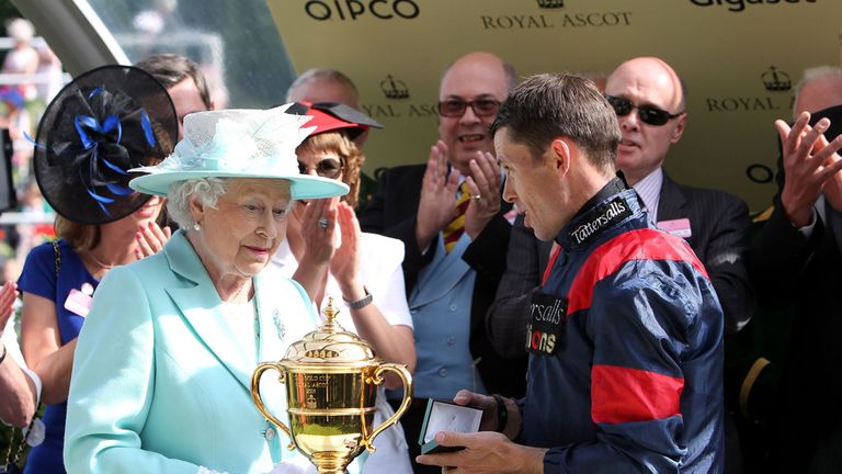 Queen Elizabeth II during the Gold Cup presentation ceremony to jockey Graham Lee
