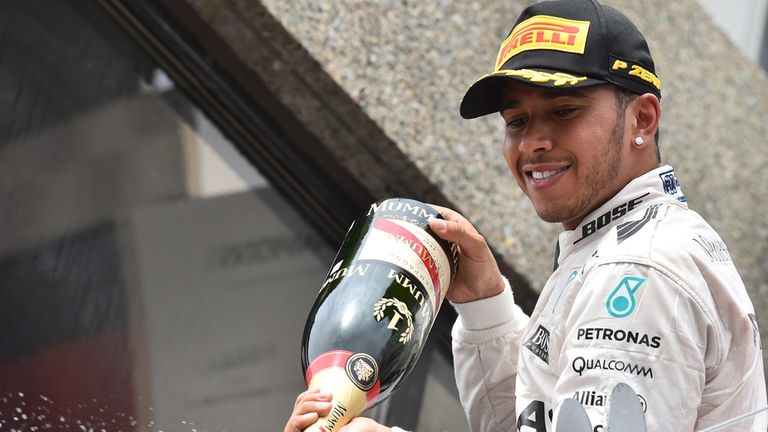 Race winner Lewis Hamilton celebrates his victory in the Canadian GP
