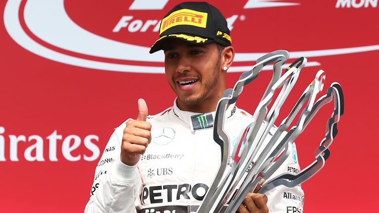 Race winner Lewis Hamilton celebrates on the podium after the Canadian GP