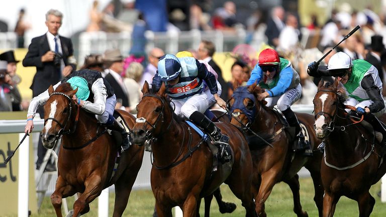 Gm Hopkins and Ryan Moore go to the front in the Royal Hunt Cup...