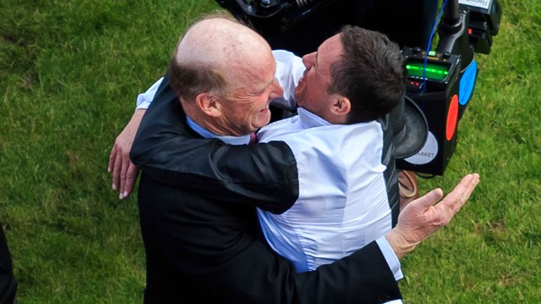 Frankie Dettori (right) celebrates with trainer John Gosden after their horse Golden Horn won The Investec Derby on Derby Day of the 2015 Investec Derby Fe