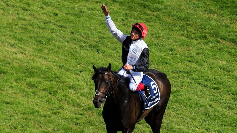 Frankie Dettori celebrates to the grandstand after winning The Investec Derby onboard Golden Horn on Derby Day of the 2015 Investec Derby Festival at Epsom