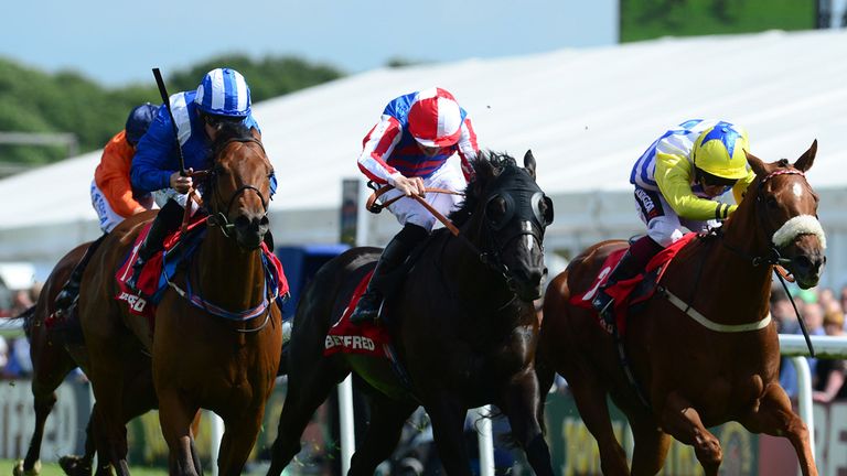 Zarwaan ridden by Paul Hanagan (left) wins the Betfred Membership 'Play Your Way' Handicap during the John Smith's Northumberland Plate Day at Newcastle Ra