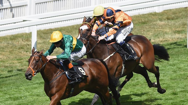 ASCOT, ENGLAND - JUNE 19:  Richard Hughes riding Illuminate (Green and Yellow) wins The Albany Stakes during Day 4 of Royal Ascot 2015 at Ascot Racecourse 