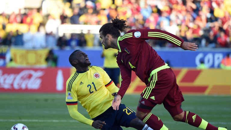 Colombia's forward Jackson Martinez and Venezuela's defender Oswaldo Vizcarrondo