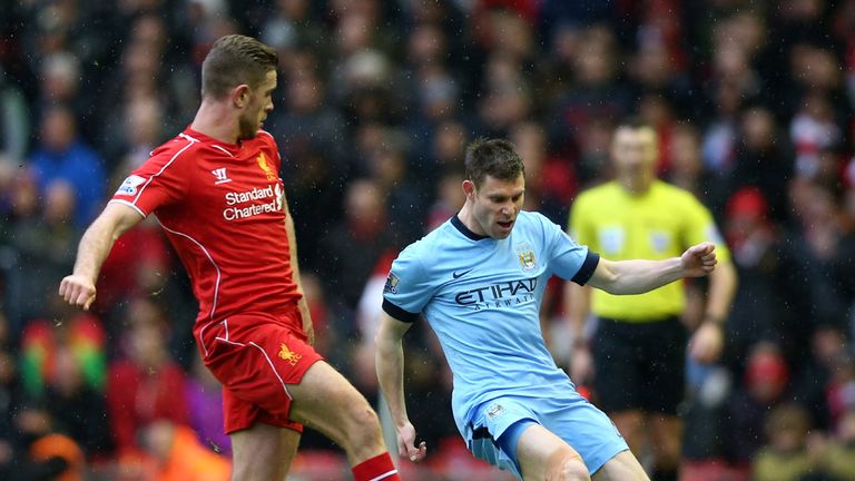 James Milner of Manchester City is closed down by Jordan Henderson of Liverpool 