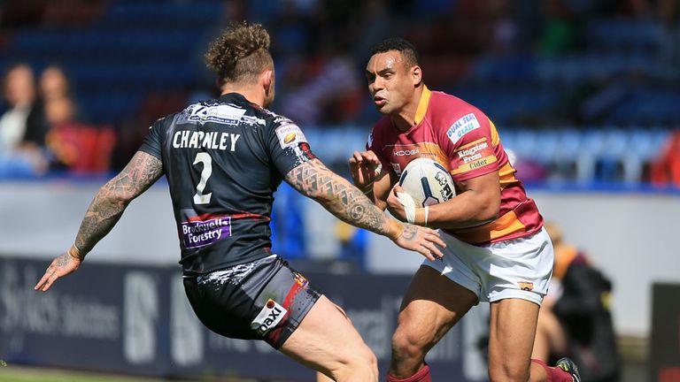 Huddersfield's Jodie Broughton is tackled by Wigan's Josh Charnley 