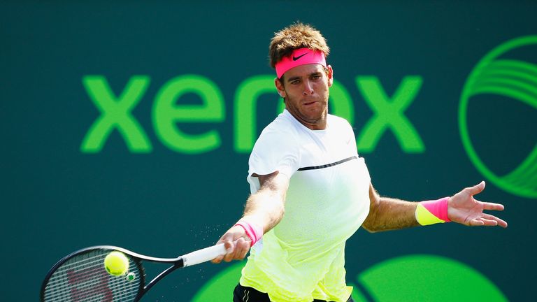 Juan Martin Del Potro returns the ball to Vasek Pospisil during day 4 of the Miami Open on March 26 2015