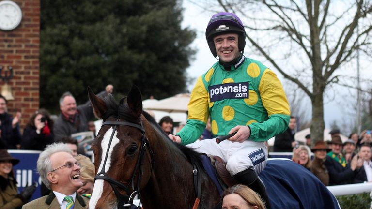 Kauto Star ridden by Ruby Walsh walks in with owner Clive Smith (left) after winning the William Hill King George VI Steeple Chase during the William Hill 