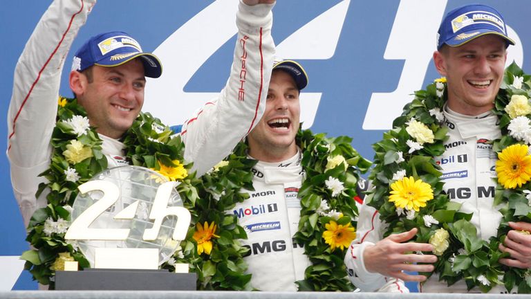 Race winners Nico Hulkenberg, Earl Bamber and Nick Tandy celebrate on the podium at Le Mans 24 Hours