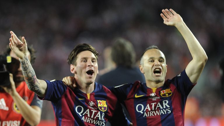 Barcelona's Lionel Messi and Andres Iniesta celebrate after winning the Copa del Rey final against Athletic Bilbao at the Camp Nou on May 30, 2015