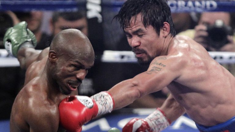 Manny Pacquiao (R) of the Philippines connects against Timothy Bradley 