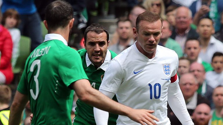 England's striker Wayne Rooney vies with Republic of Ireland defender Marc Wilson