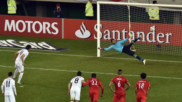 Bolivia's forward Marcelo Martins Moreno scores a penalty against Peru.