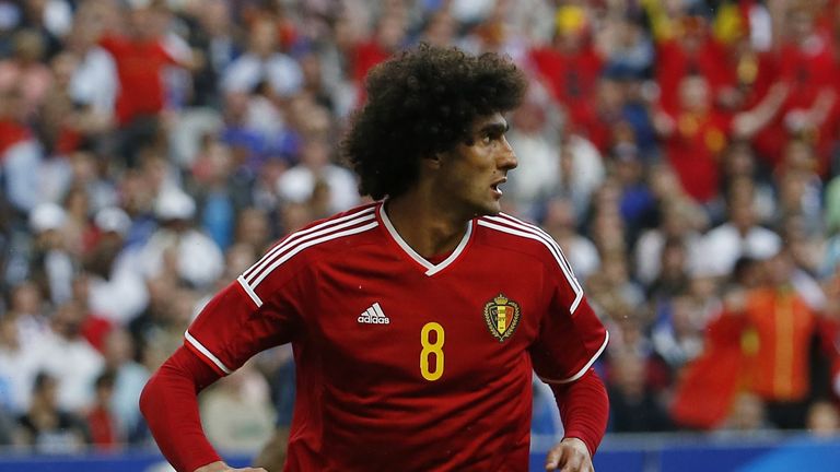 Belgium midfielder Marouane Fellaini reacts after scoring a goal during a friendly match between France and Belgium at the Stade de France