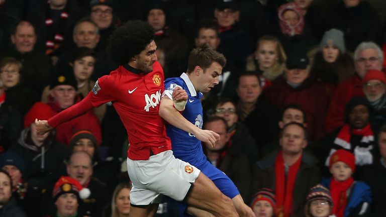 Manchester United's Marouane Fellaini and Everton's Seamus Coleman at Old Trafford on December 4, 2013 in Manchester, England.