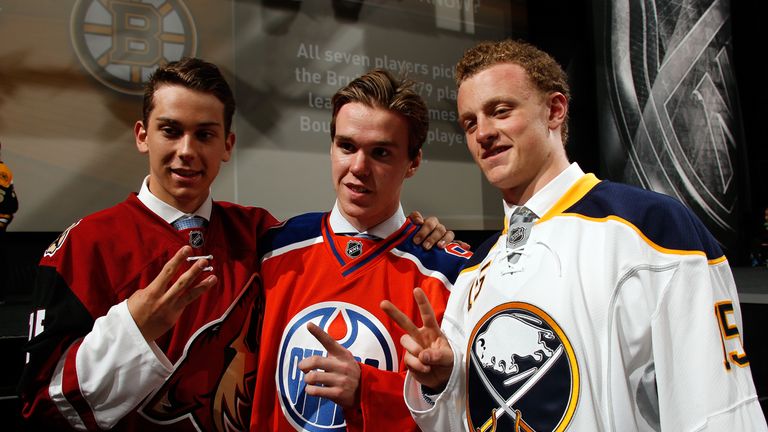 First pick Connor McDavid (C) of the Edmonton Oilers, second pick Jack Eichel (R) of the Buffalo Sabres and third pick Dylan Strome.