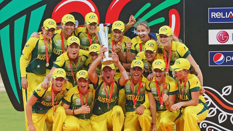 DHAKA, BANGLADESH - APRIL 06:  Captain Meg Lanning and the Australian team celebrate with the trophy on the podium after winning the Final of the ICC Women
