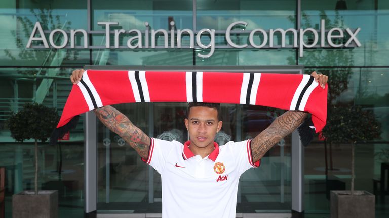 Memphis Depay poses at Manchester United's Aon Training Complex.