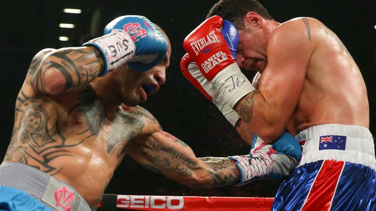 Miguel Cotto (left) lands a body shot against Daniel Geale in Brooklyn