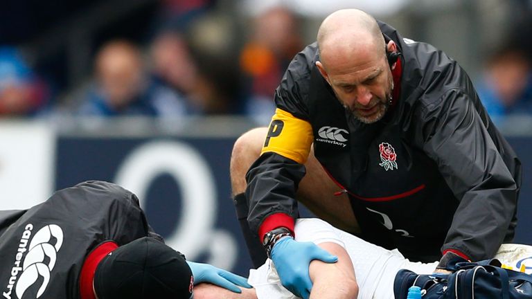 Mike Brown of England receives medical attention during the RBS Six Nations match between England and Italy