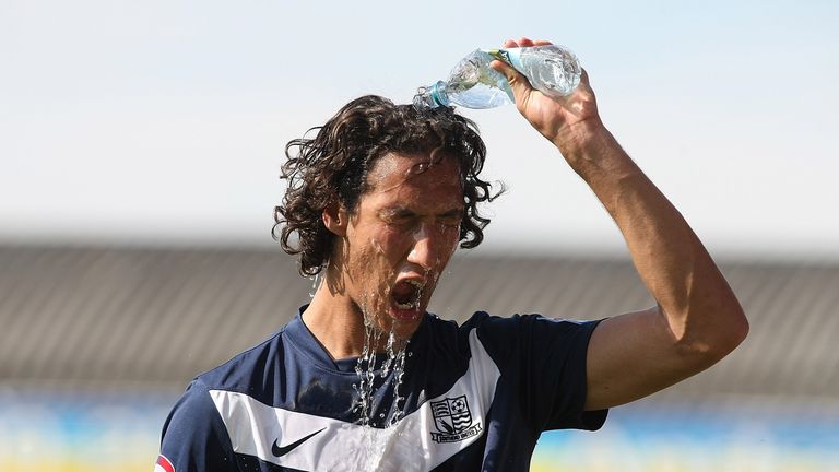 SOUTHEND, ENGLAND - SEPTEMBER 03:  Bilel Mohsni of Southend United pours a bottle of water over his head during the npower League Two match between Southen