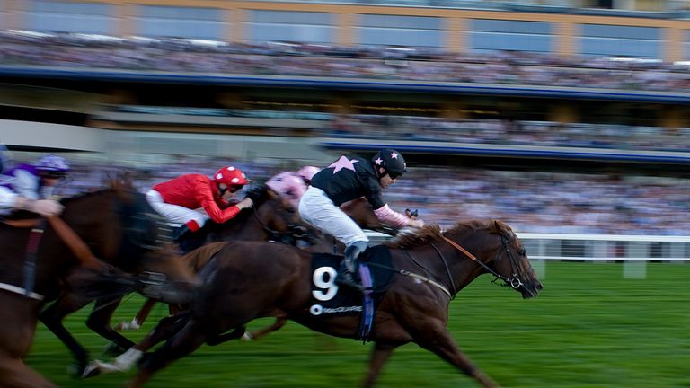 ASCOT, ENGLAND - OCTOBER 01: Robert Winston riding Move In Time win The Macquarie Group Rous Stakes at Ascot racecourse on October 01, 2011 in Ascot, Engla