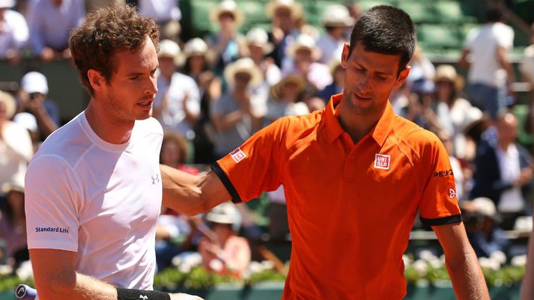 Andy Murray congratulates Novak Djokovic after defeat in their Men's Semi Final match on day fourteen of the 2015 French Open at Roland Garros
