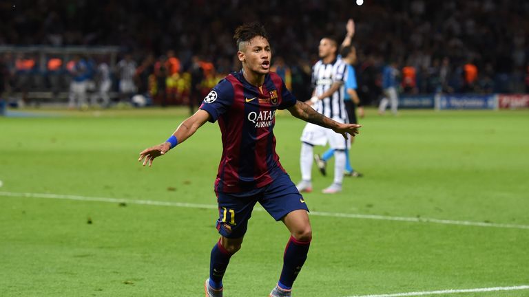 Neymar of Barcelona celebrates scoring his team's third goal during the UEFA Champions League Final