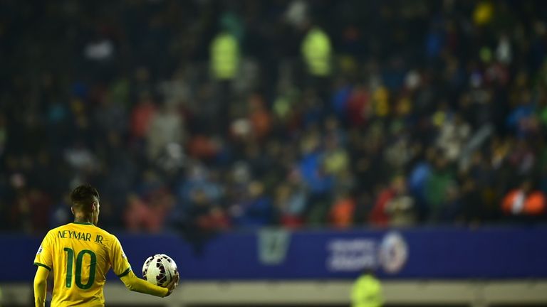 Brazil's forward Neymar holds the ball after their 2015 Copa America football championship match against Peru