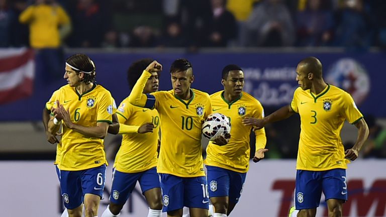 Neymar celebrates his early equaliser for Brazil against Peru