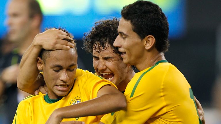 EAST RUTHERFORD, NJ - AUGUST 10:  Neymar #11, Paulo Henrique Ganso #10 and Alexandre Pato #9 of Brazil celebrate Neymar's goal against the U.S. in the firs
